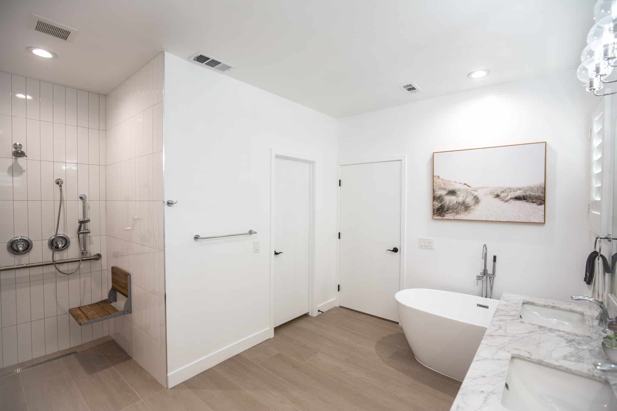 Roll-in shower with fold-down bench and handheld showerhead on slide bar in Indio vacation rental